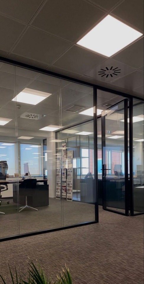 Clean office with glass meeting room partitions